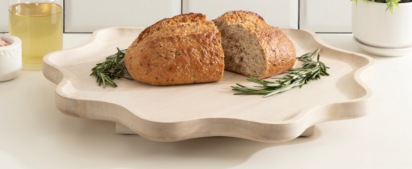 Lazy Susan decorative wood tray with sprig of rosemary and bread